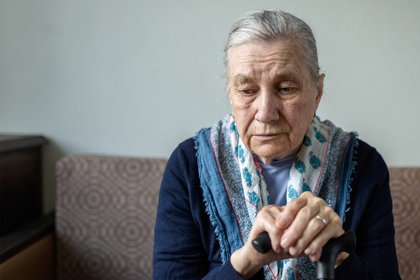 Photo of a sad woman with a pretty scarf