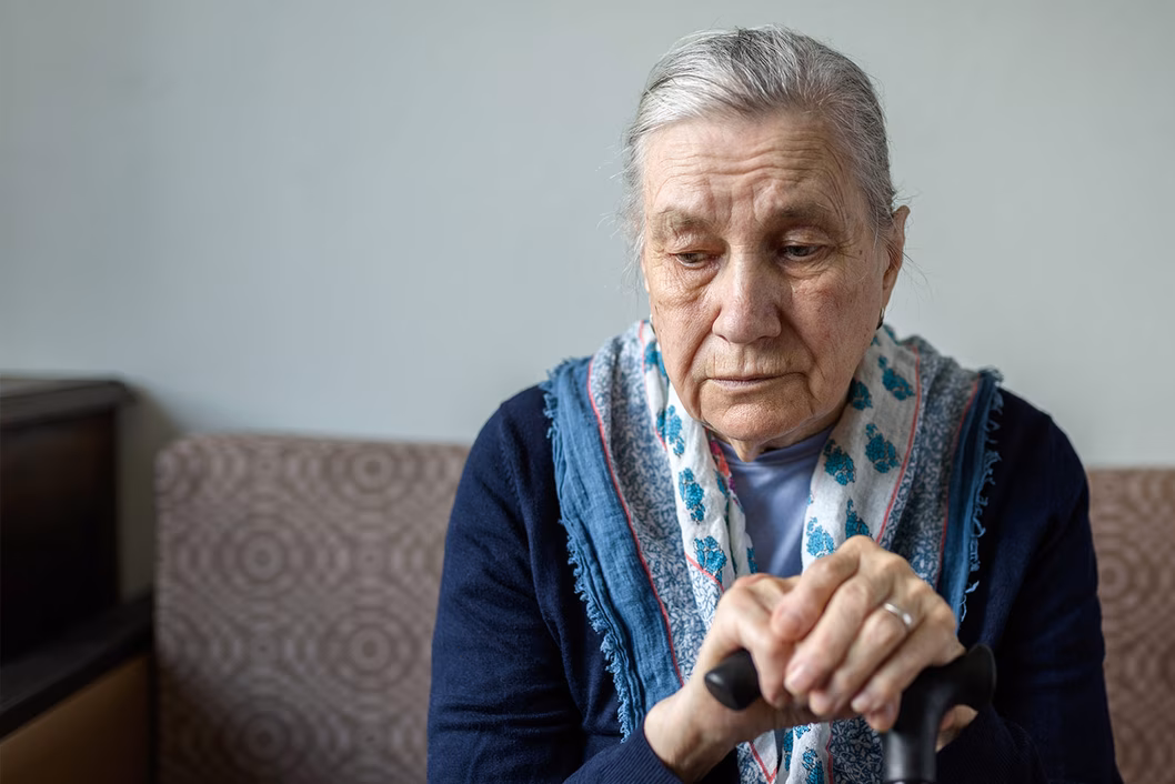 Photo of a sad woman with a pretty scarf