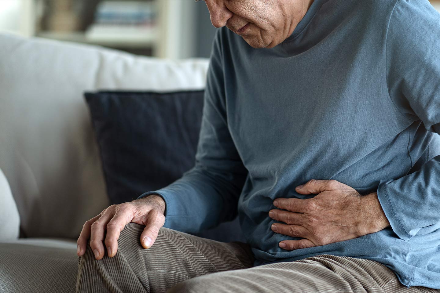 Photo of man with his hand on his stomach