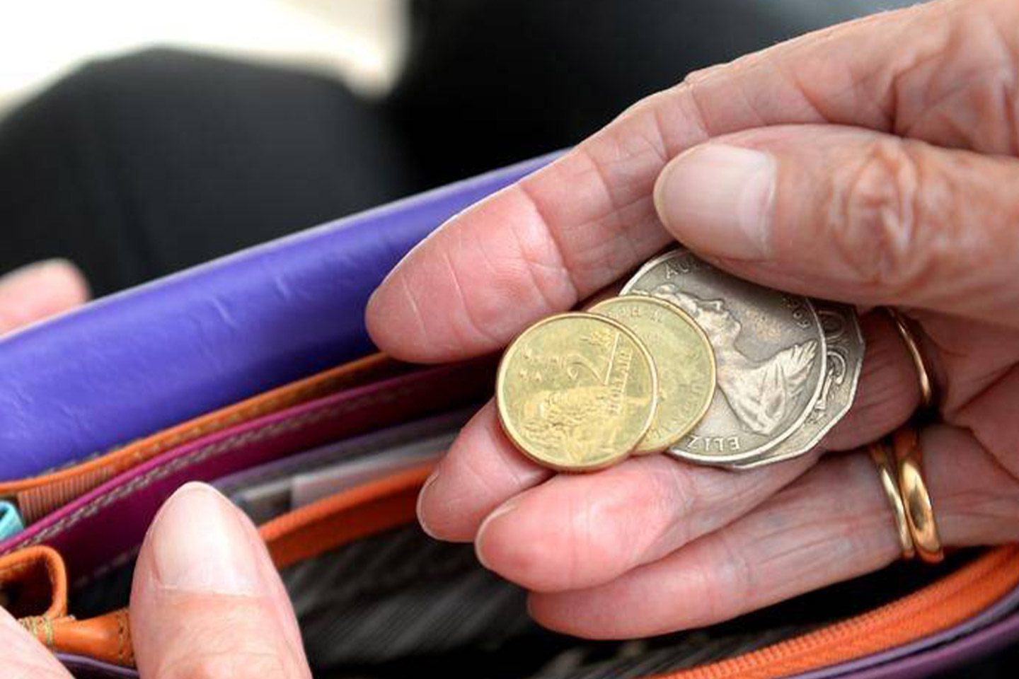 Photo of coins in an older person's hand