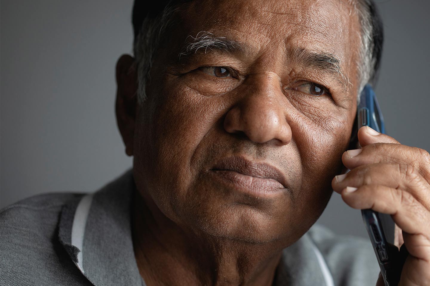 Photo of a man using a mobile phone