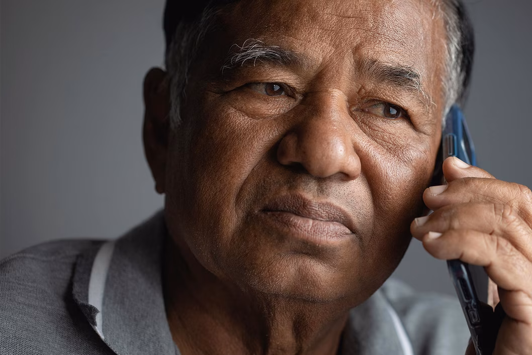 Photo of a man using a mobile phone