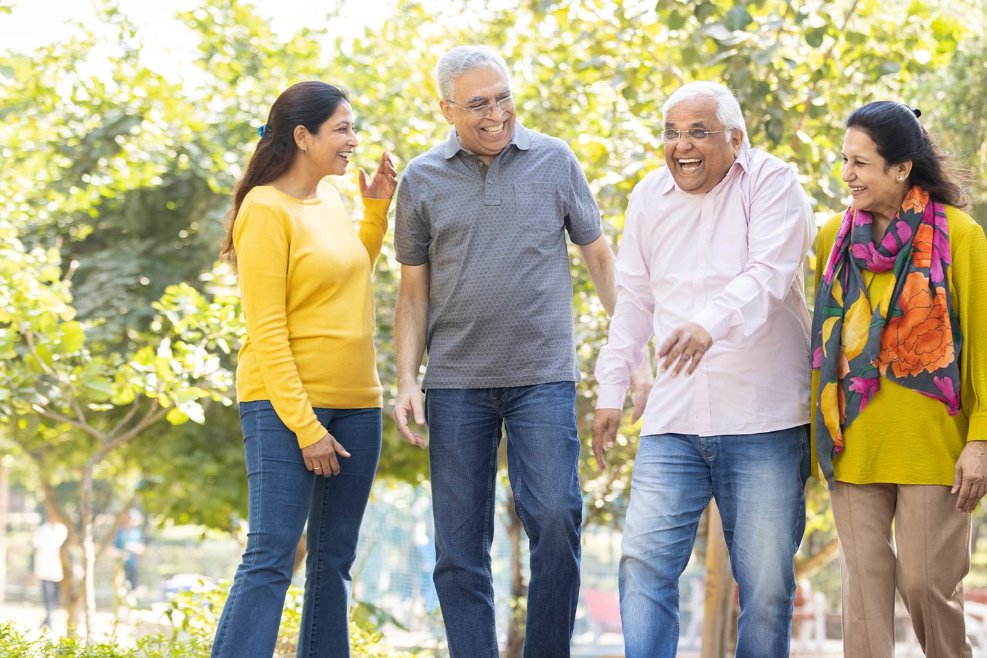 Photo of a group of four people walking in nature