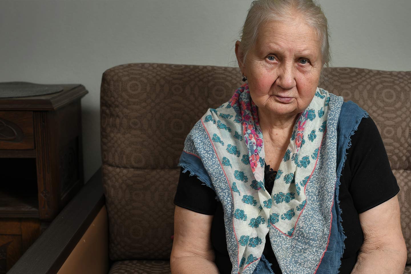 Photo of a woman wearing a pretty blue scarf