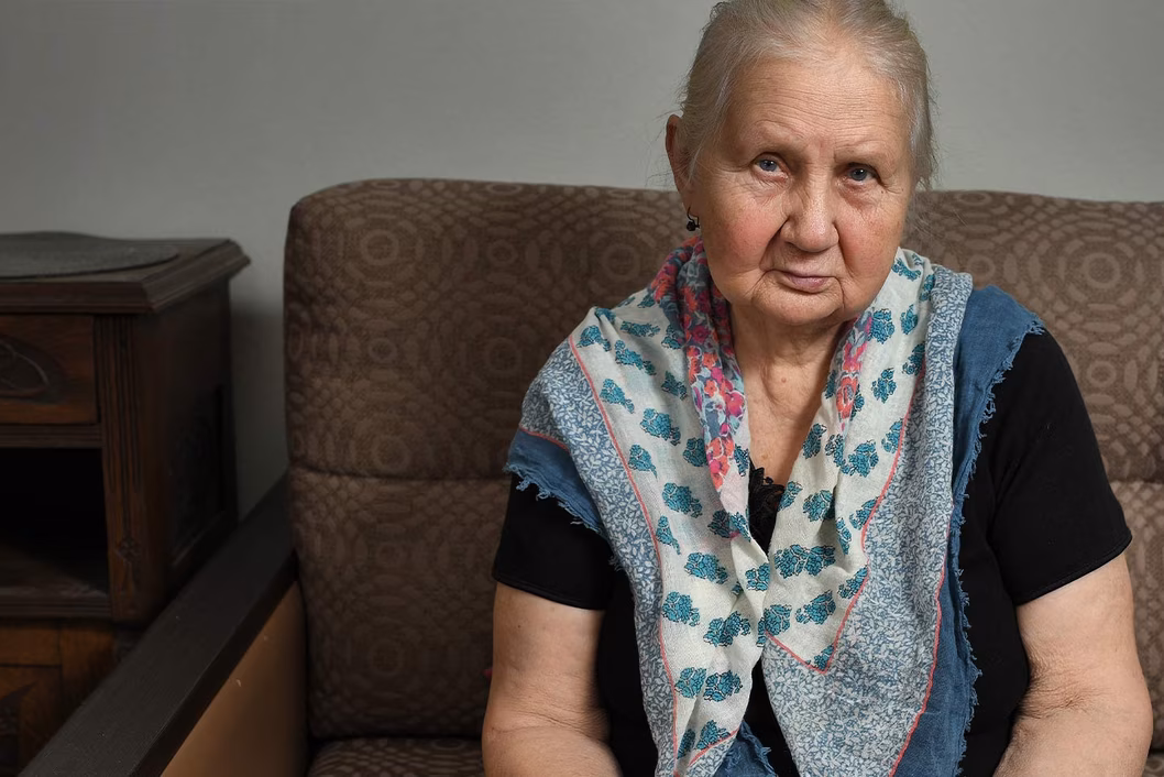 Photo of a woman wearing a pretty blue scarf