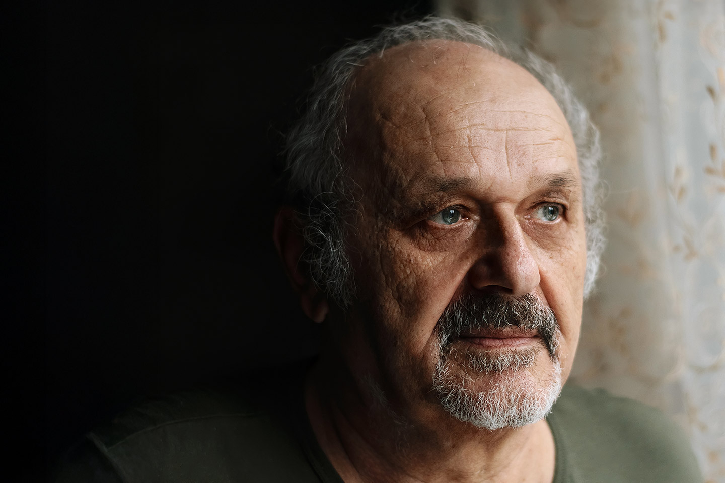 Image of an older man looking sad