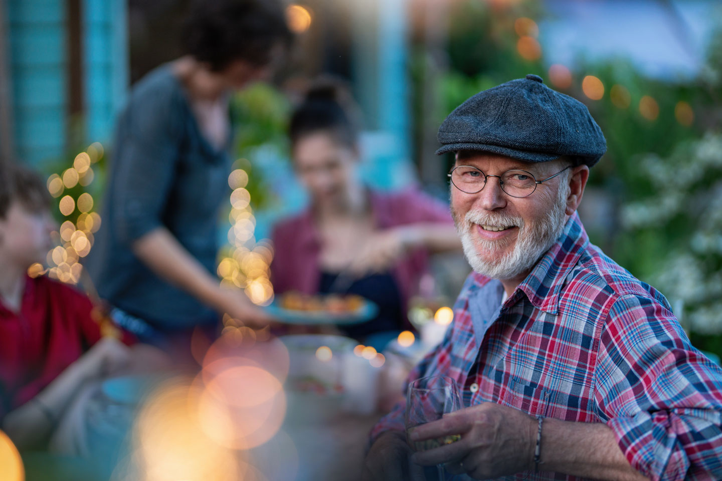 Senior man having dinner in the back yard