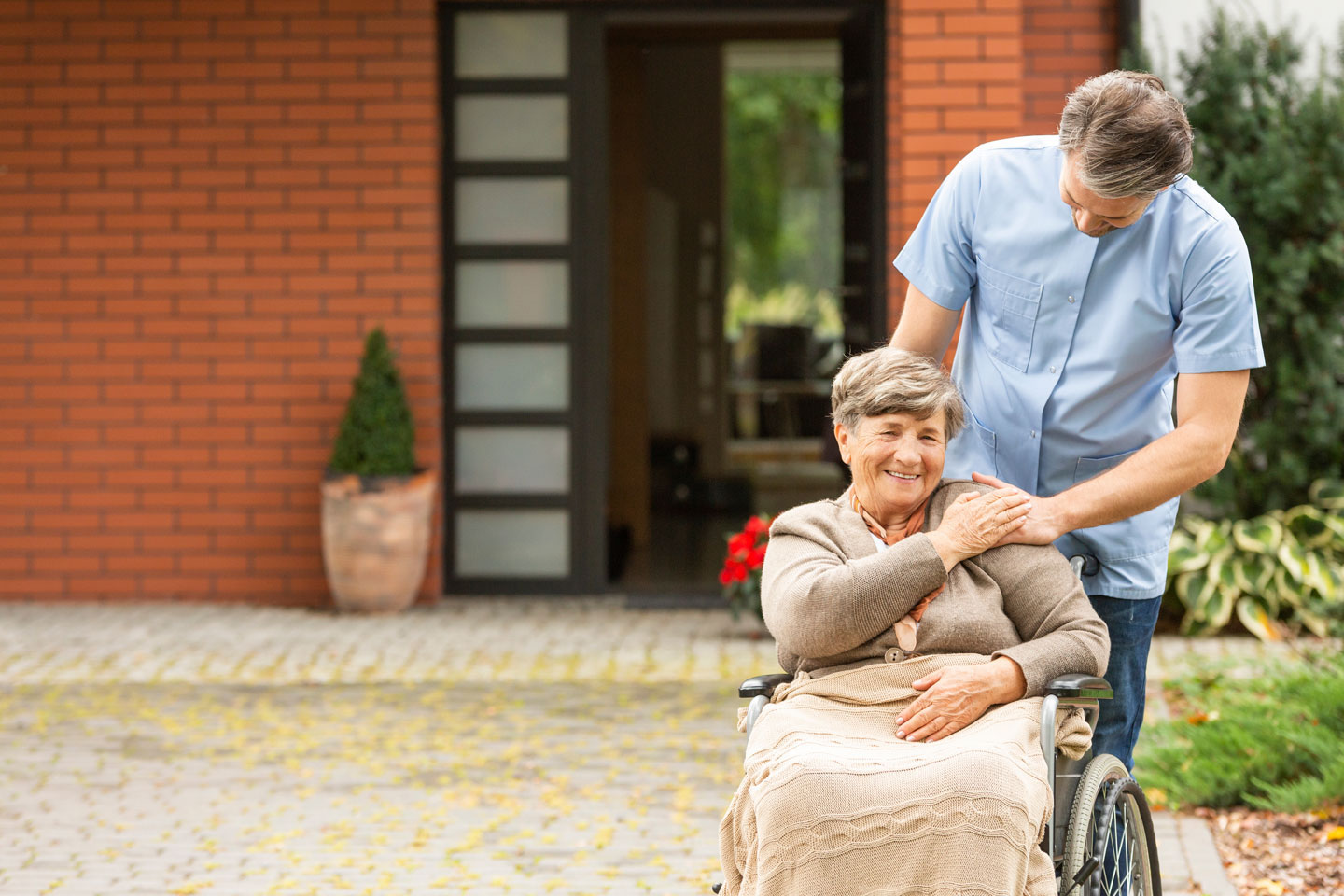 Male aged care worker with senior woman