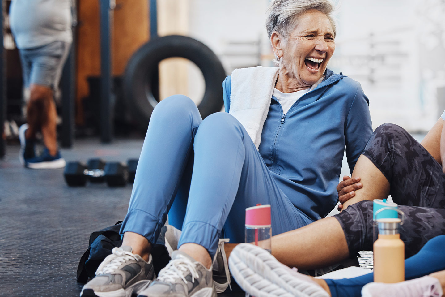 Photo of a woman laughing in a fitness class