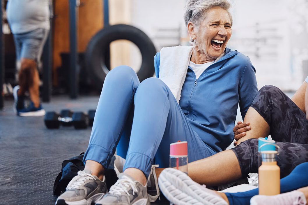 Photo of a woman laughing in a fitness class