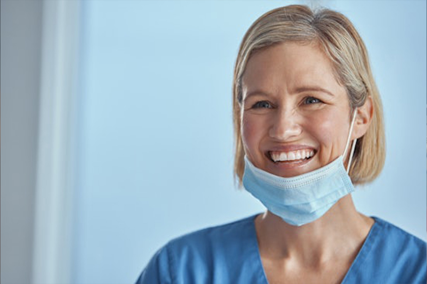 Photo of a healthcare worker smiling with a mask