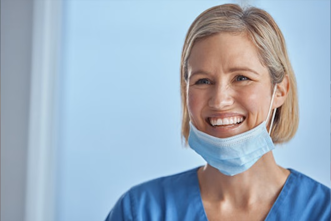 Photo of a healthcare worker smiling with a mask