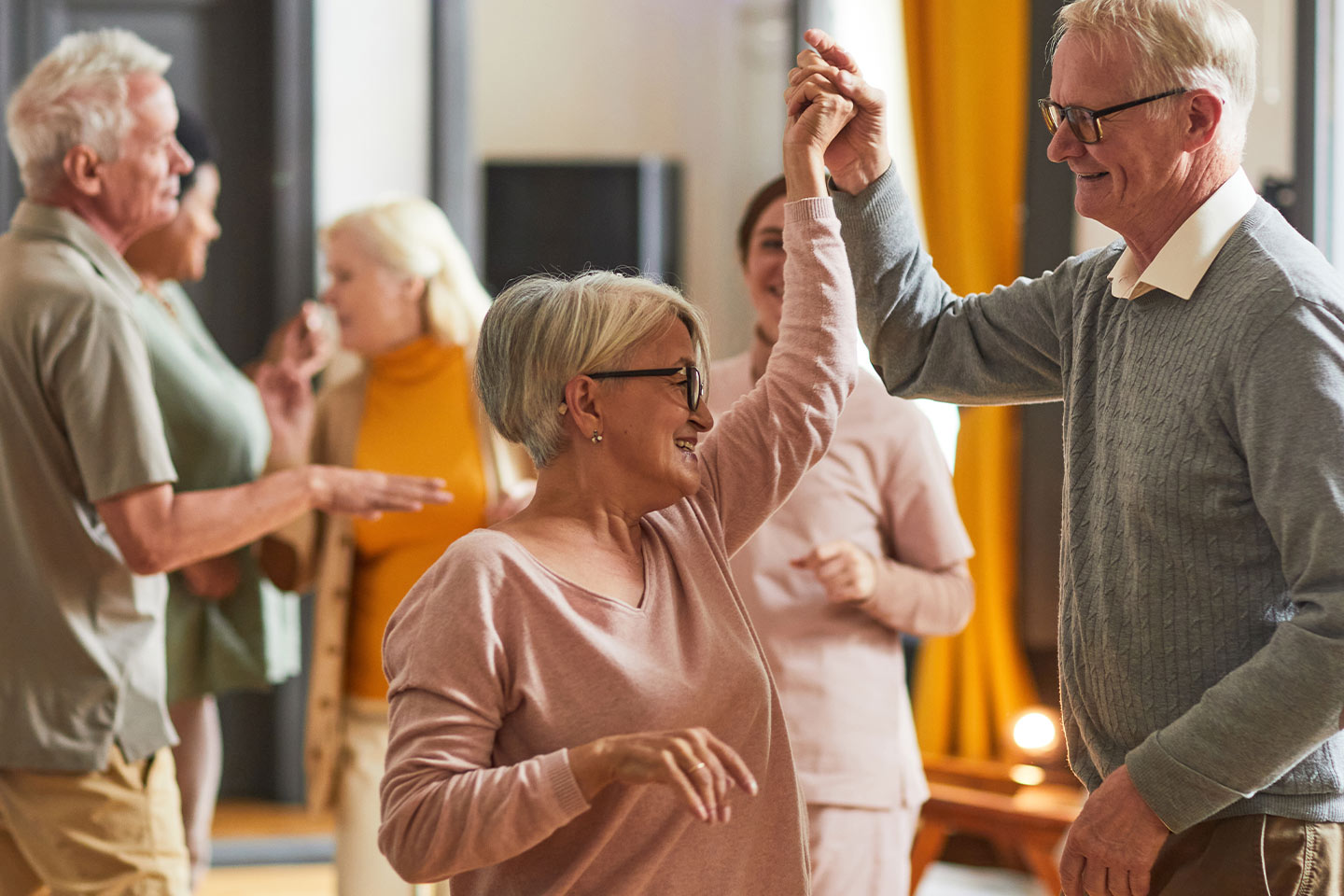 Photo of people dancing while wearing earthy tones