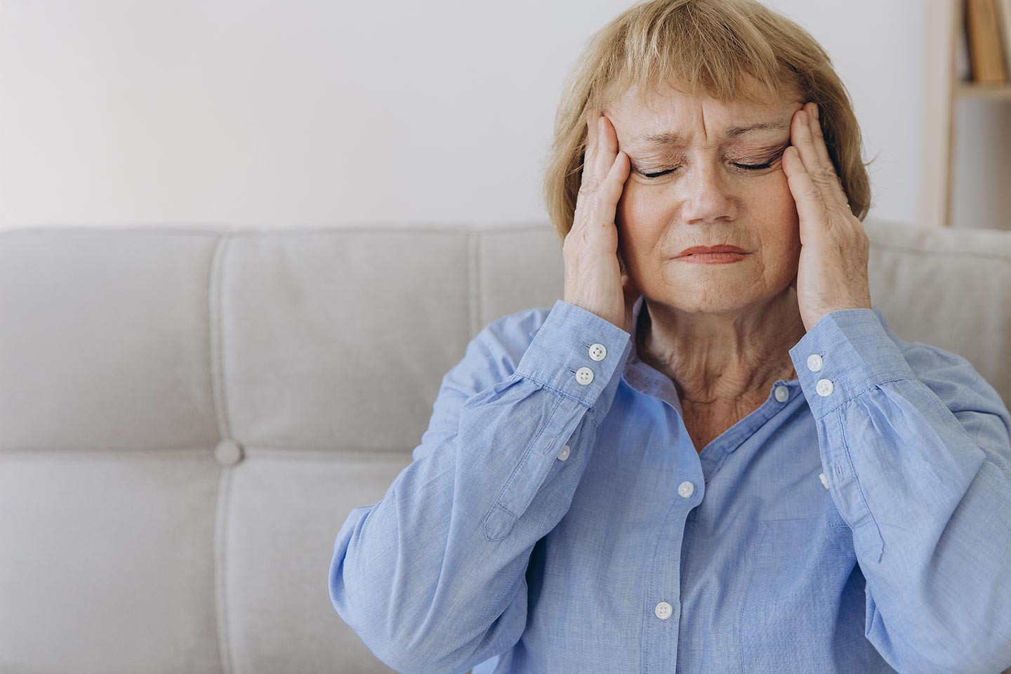 Photo of a woman massaging her temples