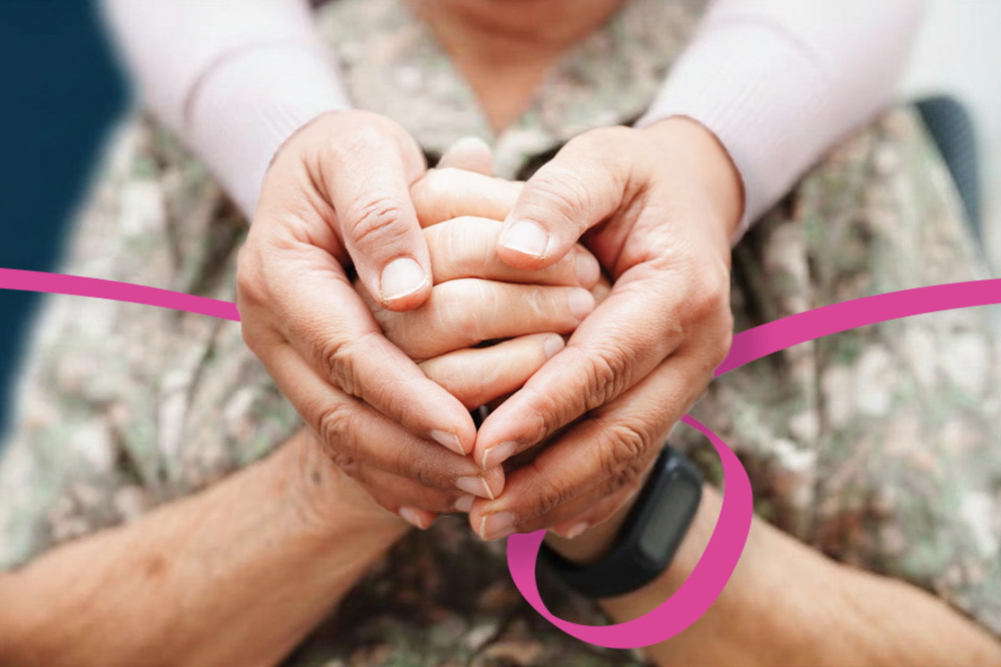 Image of a younger person holding the hands of an older person