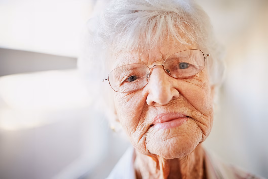 Photo of woman wearing wire rimmed glasses