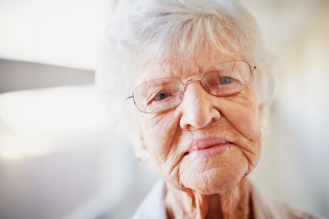 Photo of woman wearing wire rimmed glasses