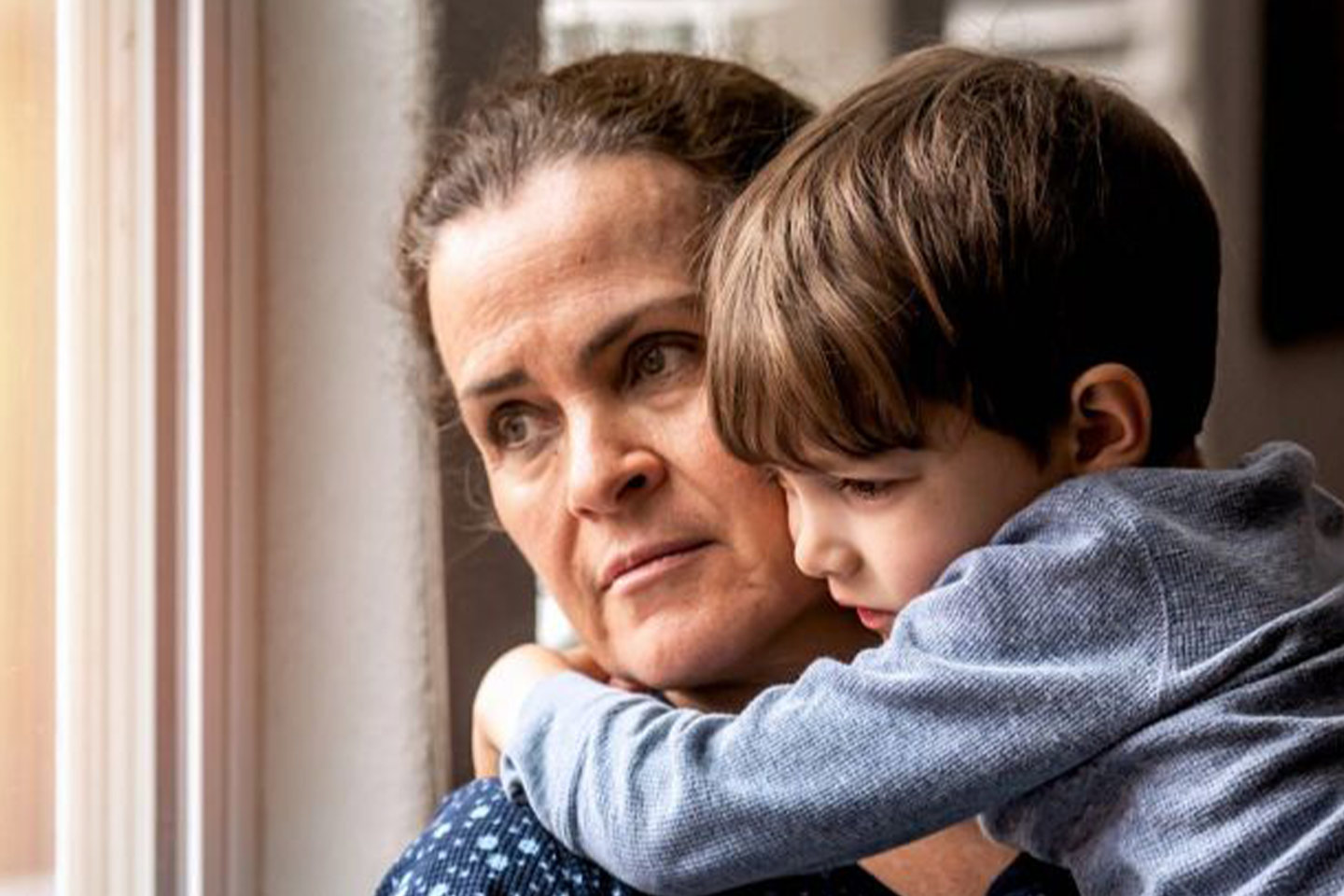 Photo of older woman holding child