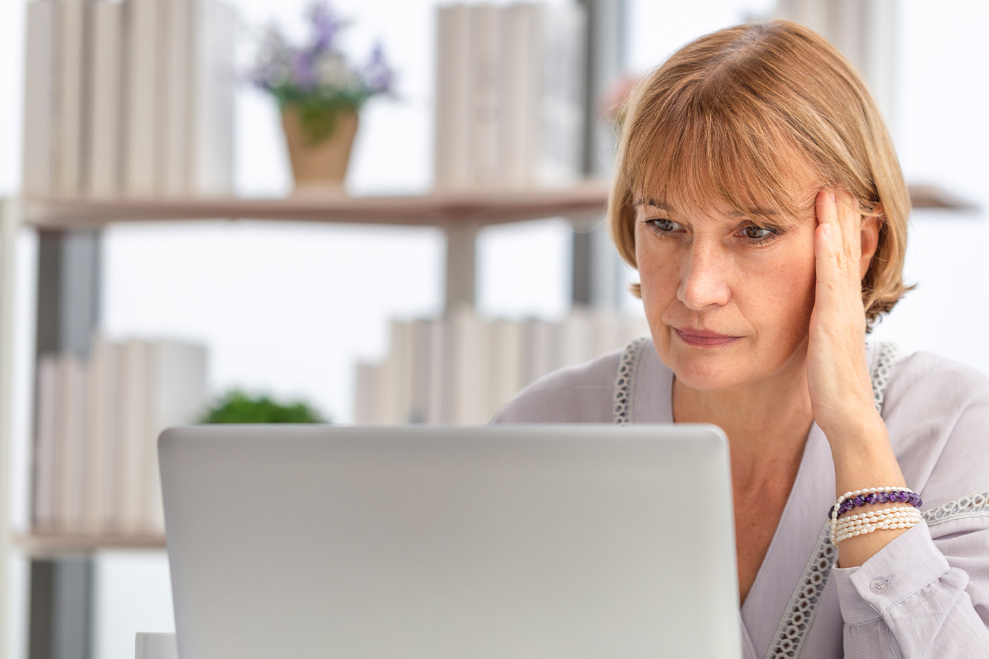Photo of a woman working on her laptop