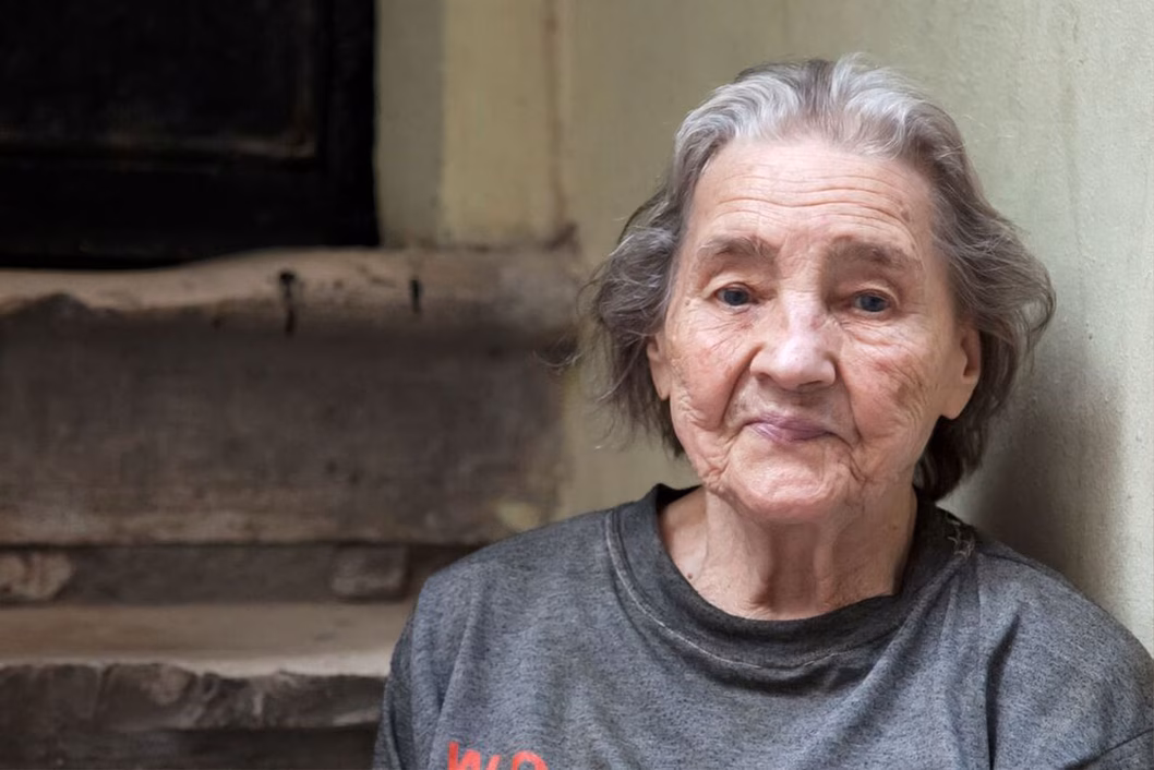Photo of a woman wearing a grey top