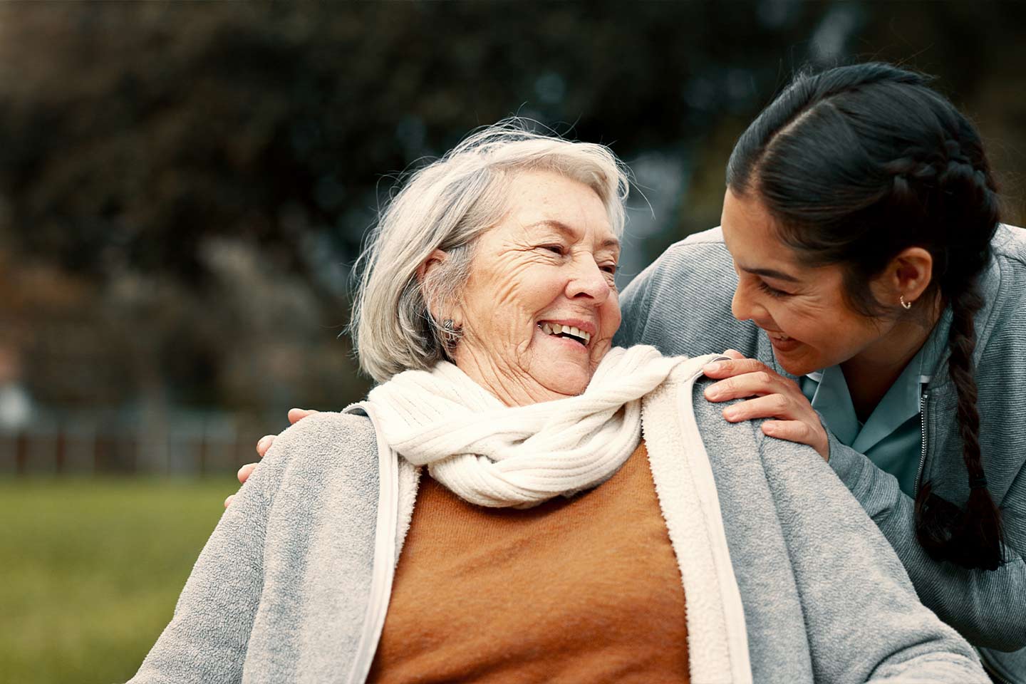 Photo of two women laughing