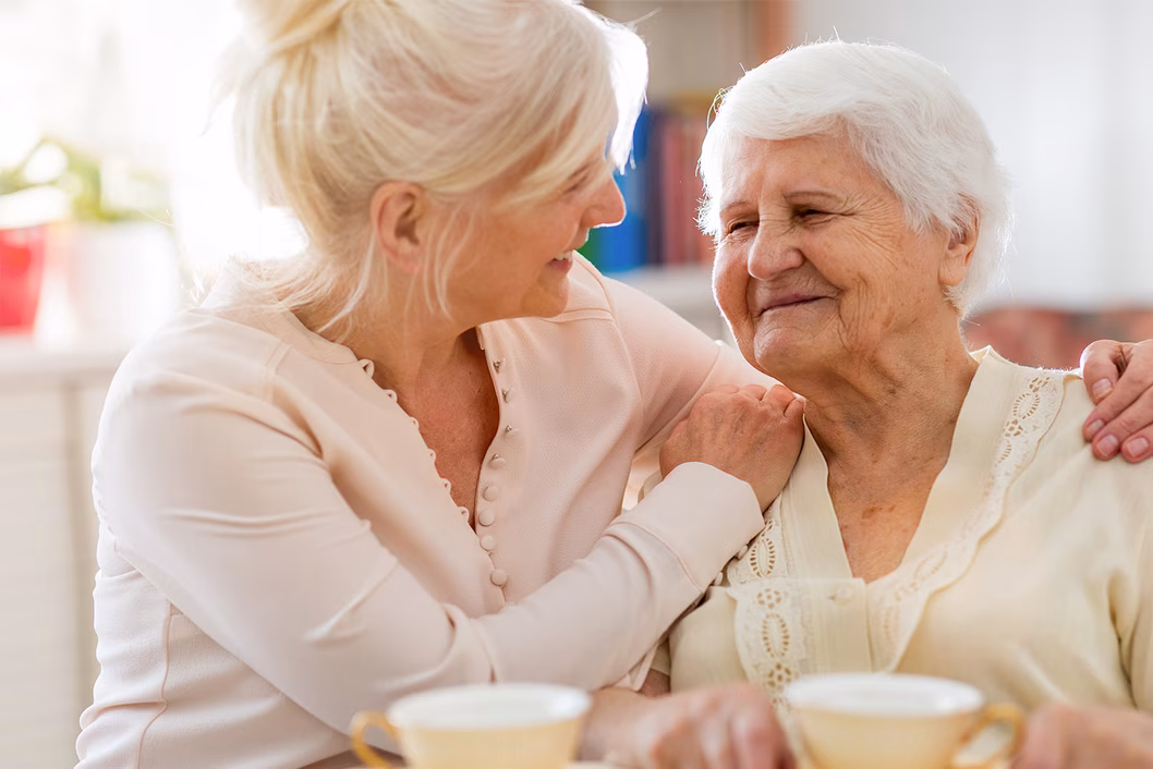 Photo of two women enjoying a tea break together