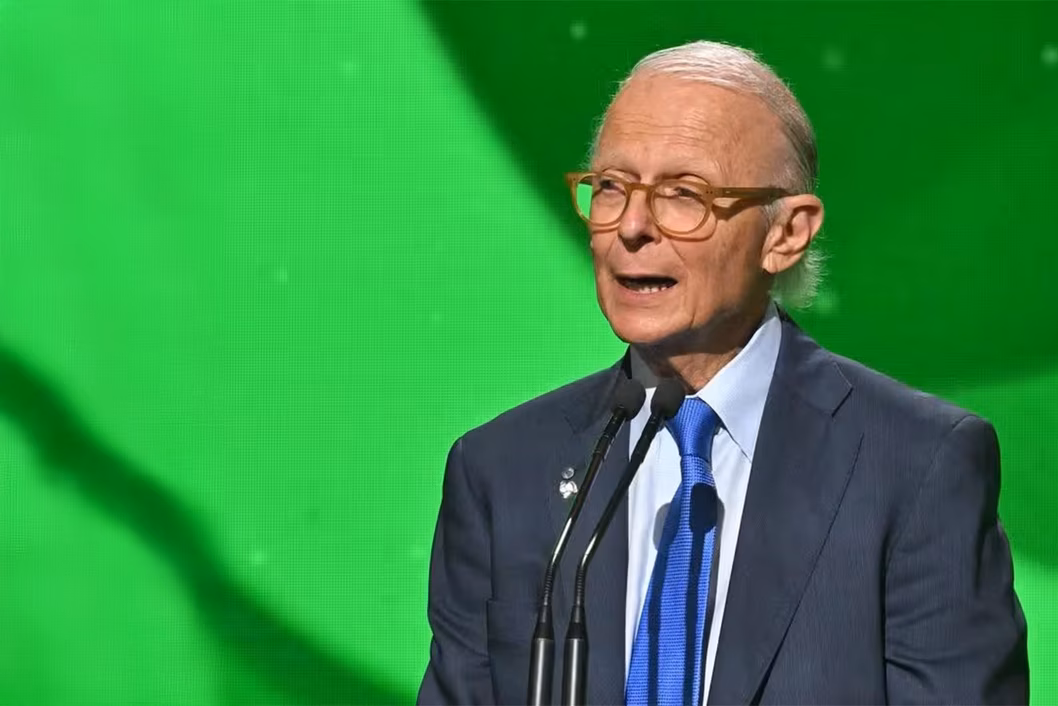 Photo of Dr Brodaty speaking in front of a green screen