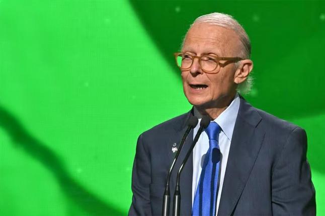 Photo of Dr Brodaty speaking in front of a green screen