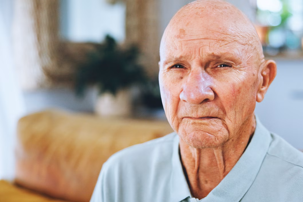 Photo of man wearing a pale blue shirt