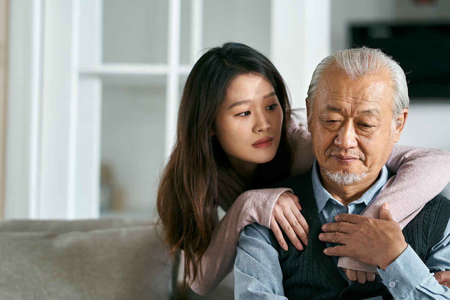 Photo of young woman consoling a man