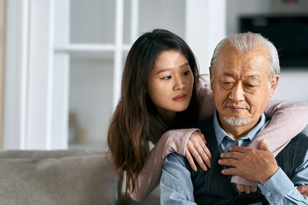 Photo of young woman consoling a man