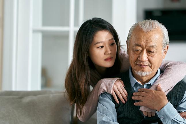 Photo of young woman consoling a man