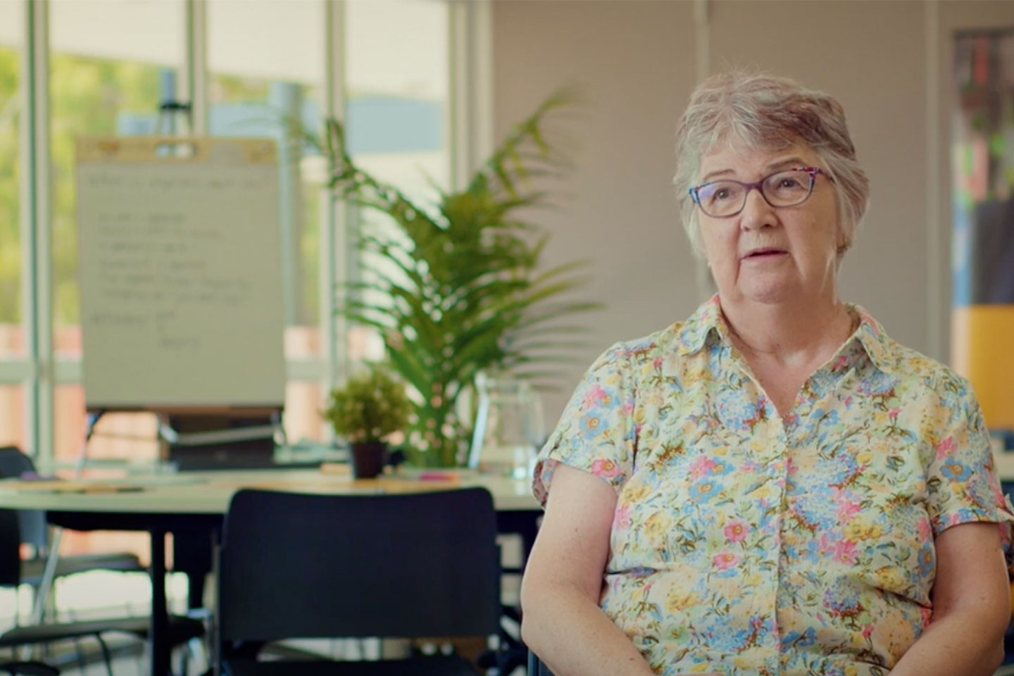 Photo of a woman in a meeting room