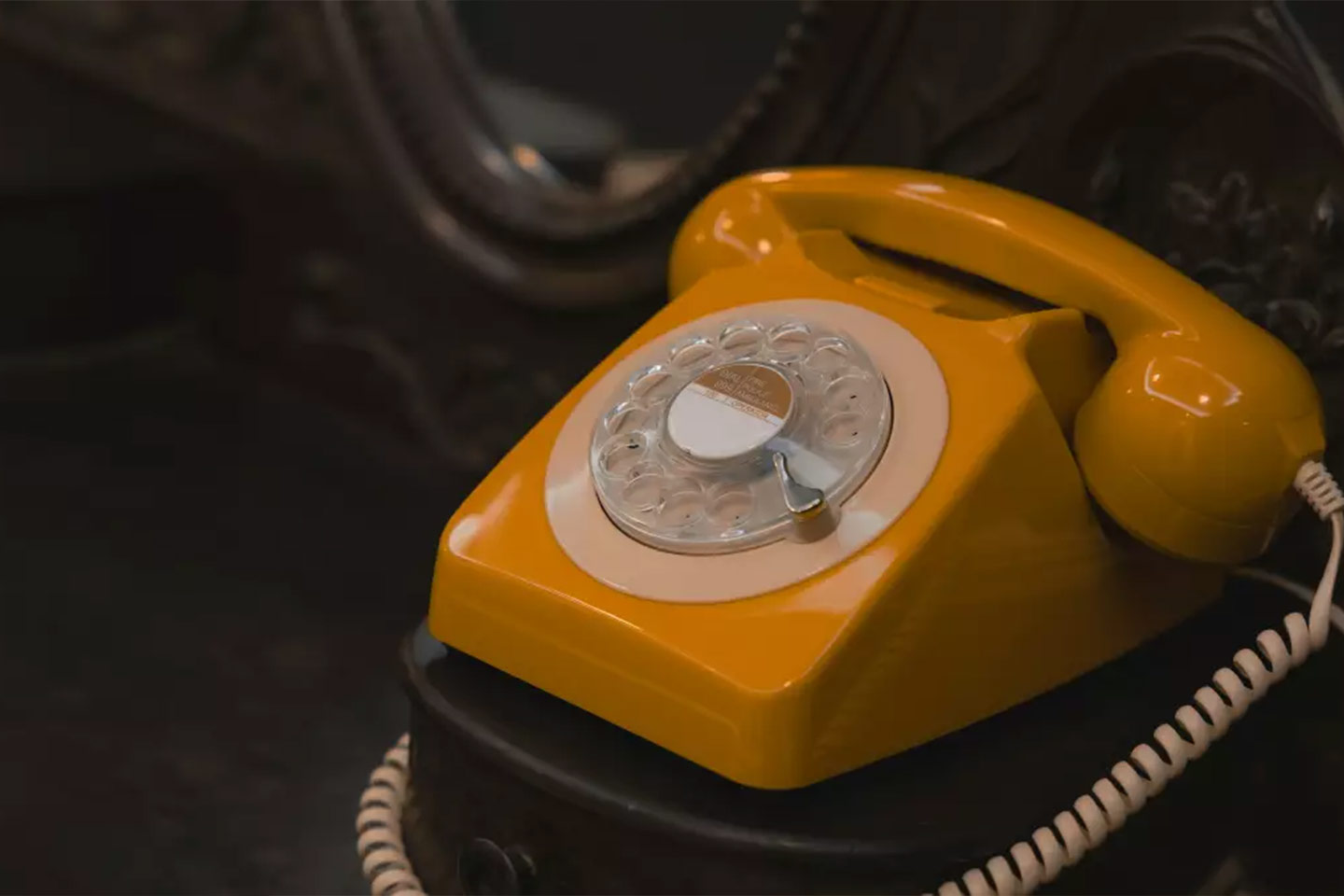 Photo of a retro orange dial telephone