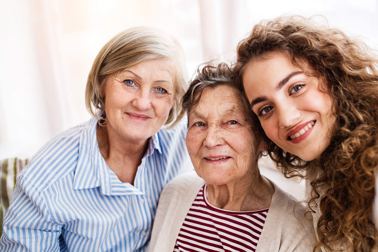 Photo of three generations of smiling women