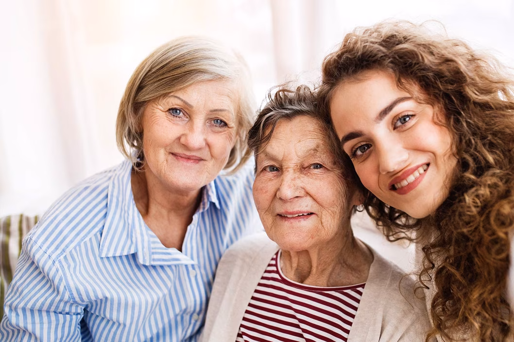 Photo of three generations of smiling women