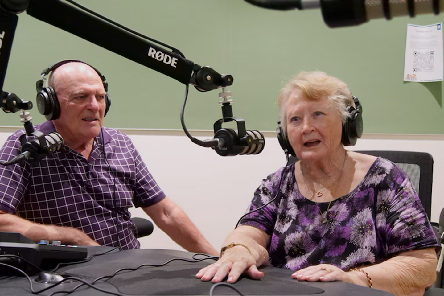 Photo of two seniors hosting a podcast