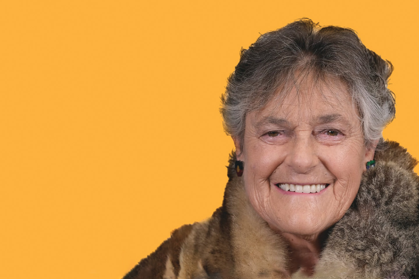 Photo of a mature woman on a yellow background