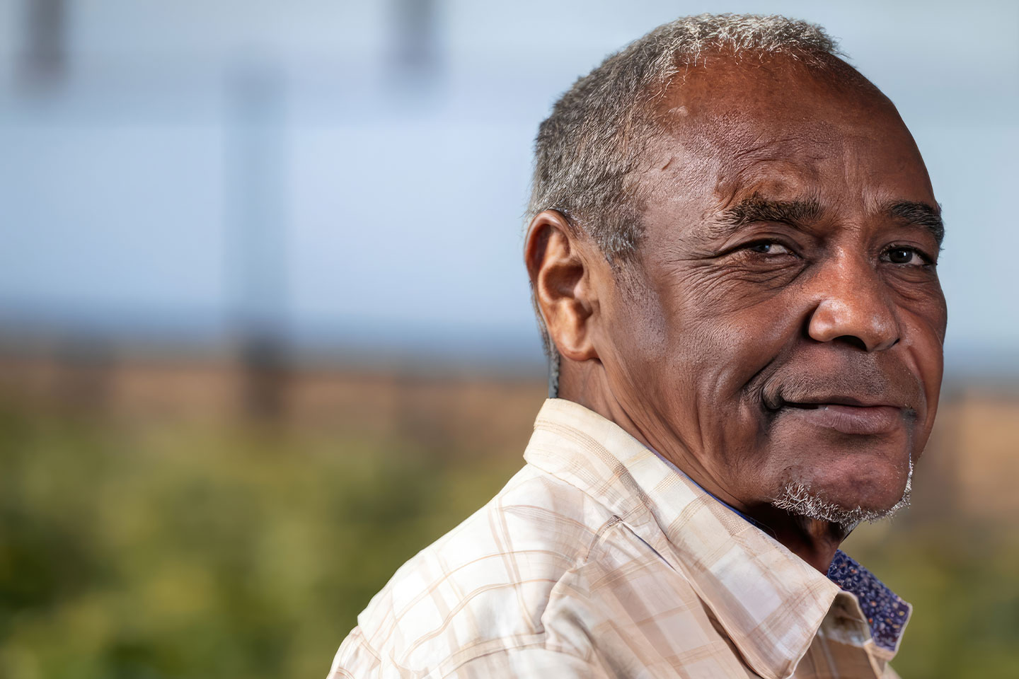 Photo of man in a cream check shirt