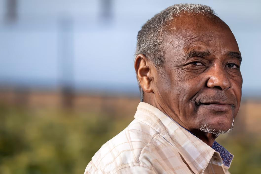 Photo of man in a cream check shirt