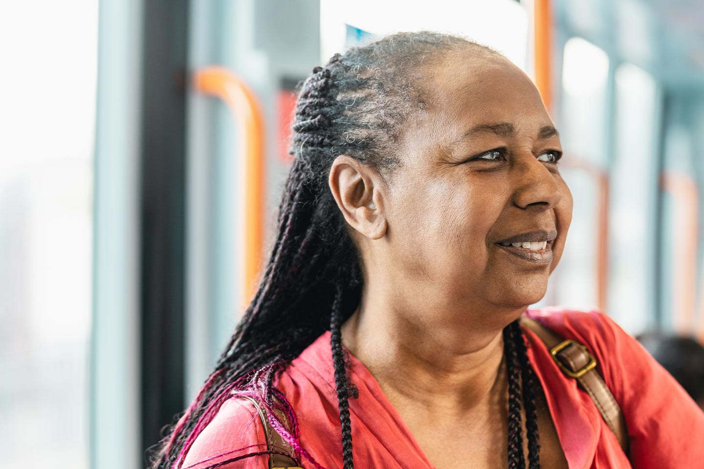 Photo of woman with braided hair and a red shirt