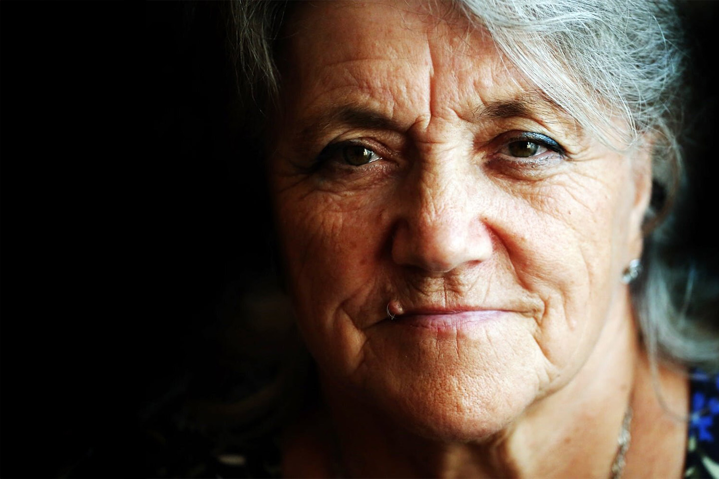 Photo of woman on a moody black background