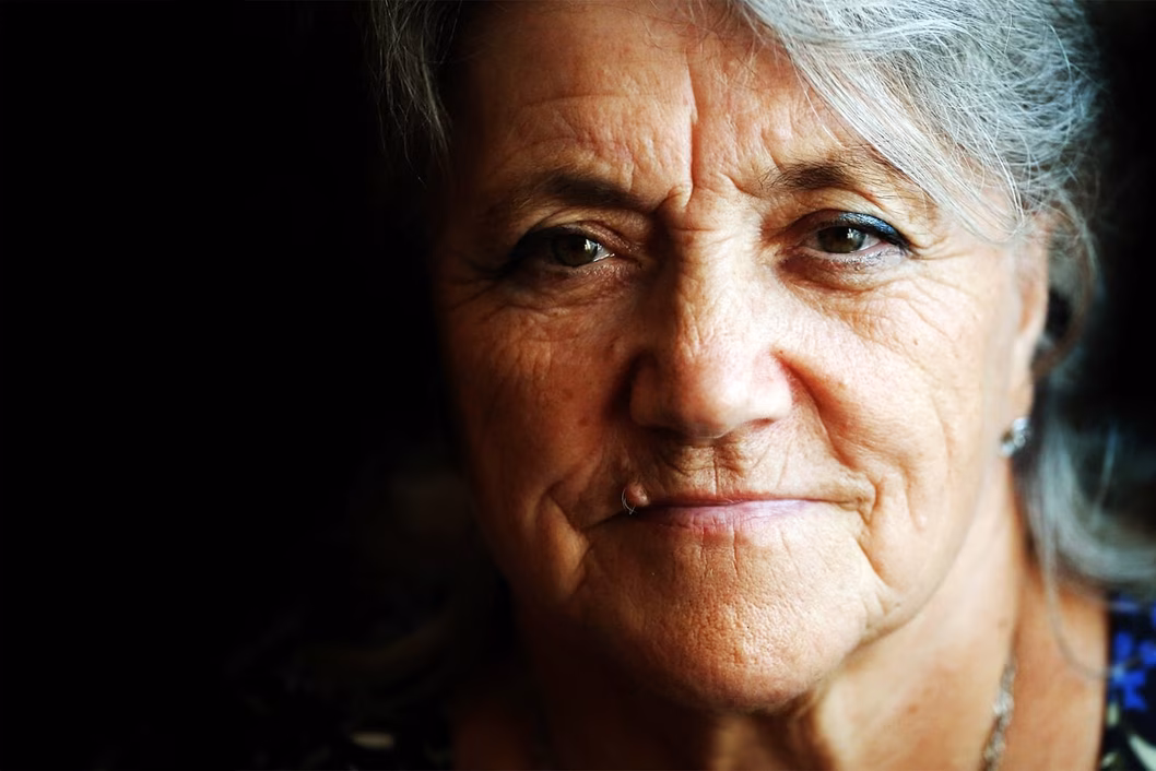 Photo of woman on a moody black background