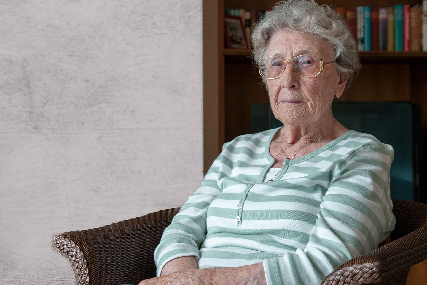 Photo of a woman wearing a green striped jumper