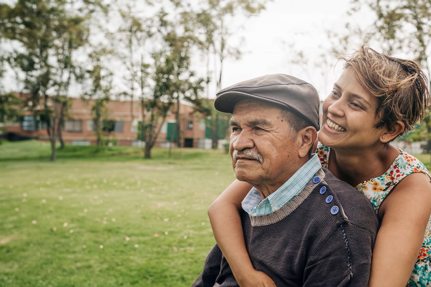 Image of a grandfather and granddaughter in a park