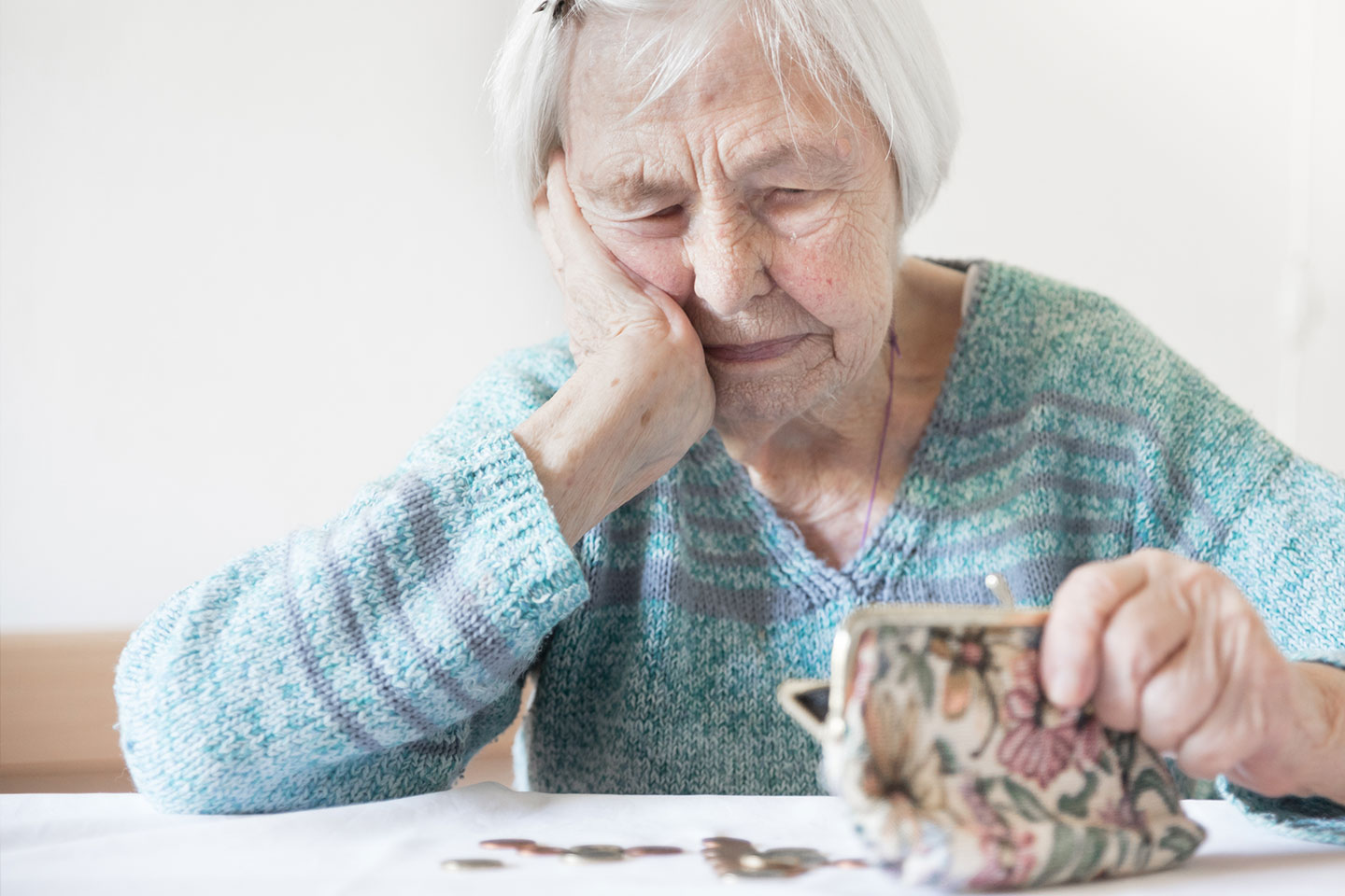 Photo of a woman looking into her purse