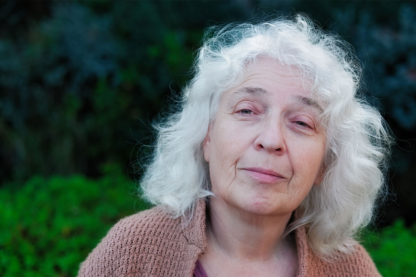 Image of an older woman with shoulder length white hair