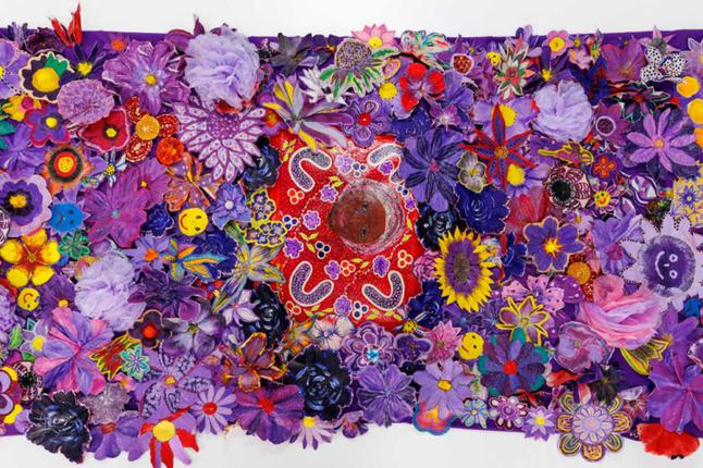 Photo of beautiful purple woven flowers forming a rug