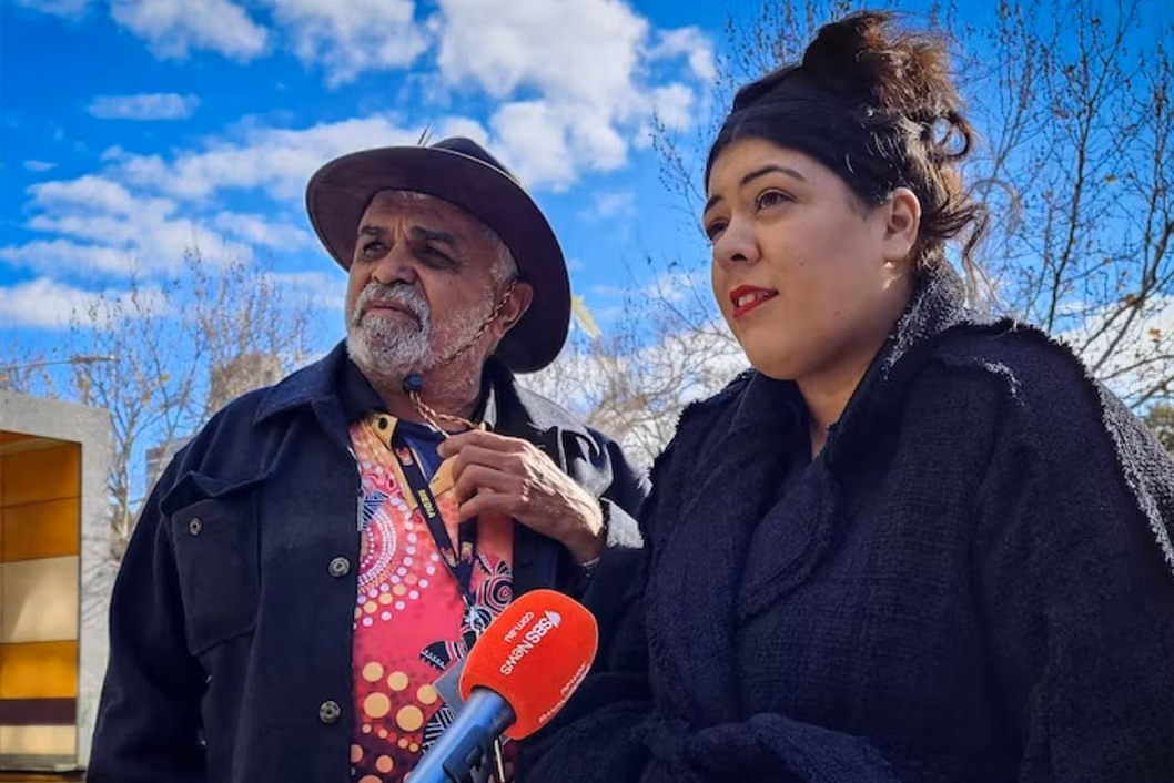 Photo of two indigenous people being interviewed