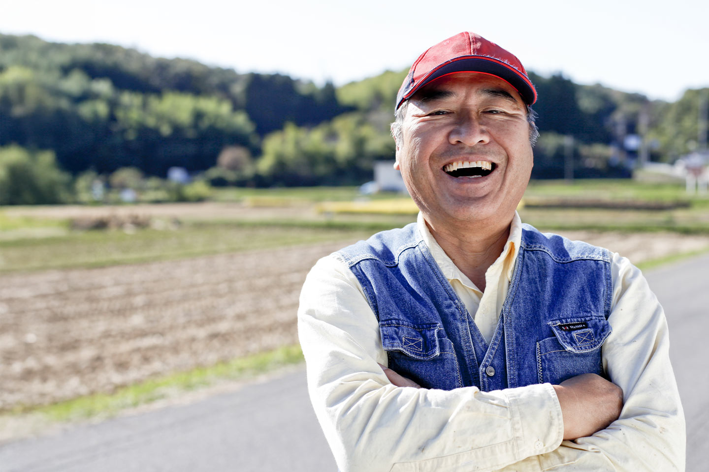 Image of a smiling older Asian man